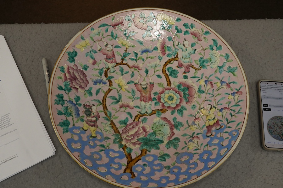 A Chinese enamelled porcelain pink ground ‘boys’ dish, mid 19th century